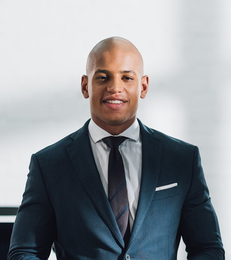 young-african-american-businessman-holding-digital-FYREY7J
